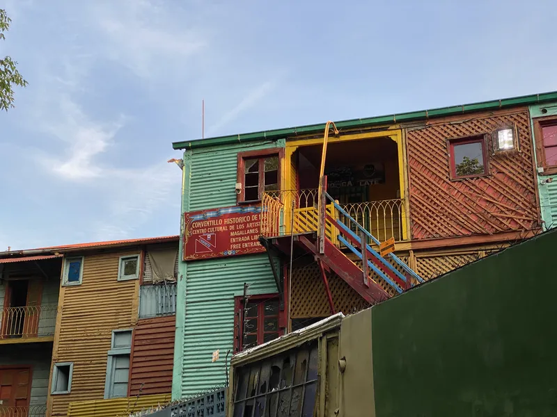 Colorful corrugated metal buildings with external staircases in the La Boca conventillo district of Buenos Aires